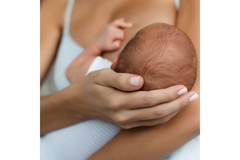 Image Woman breast feeding.